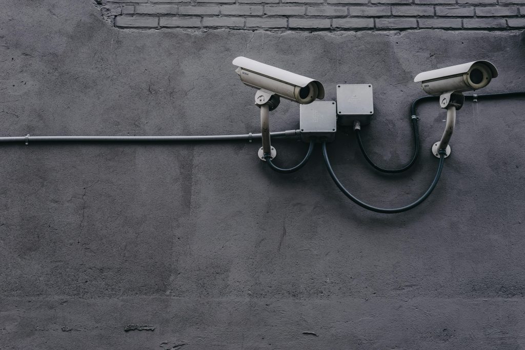 pexels photo 430208 430208 Two surveillance cameras mounted on a concrete wall, highlighting security technology.